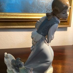 Lladró Porcelain Figurine Naughty Dog pulling a Girl’ Skirt.